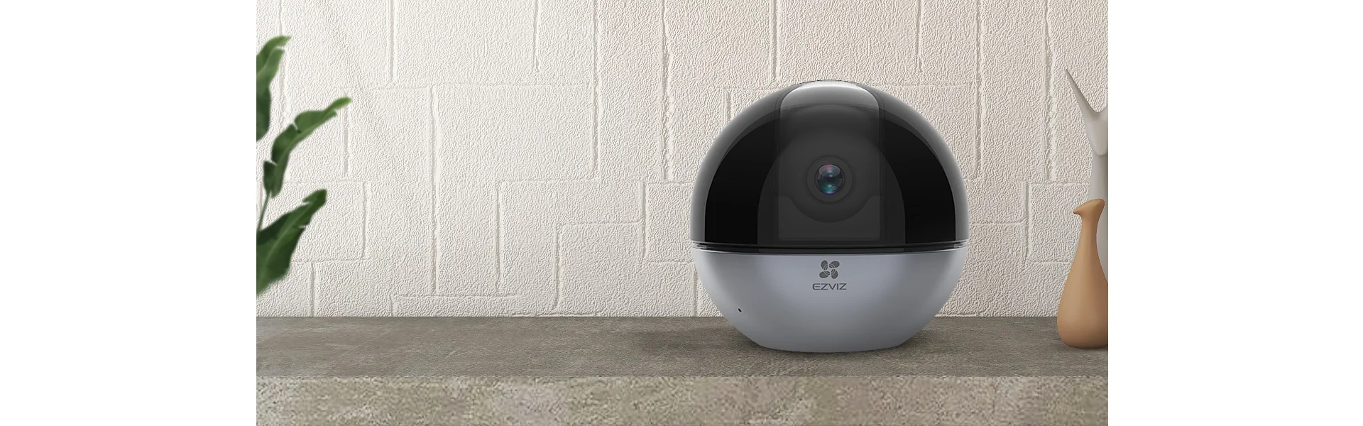 EZVIZ C6W 4MP camera on a shelf in a living room