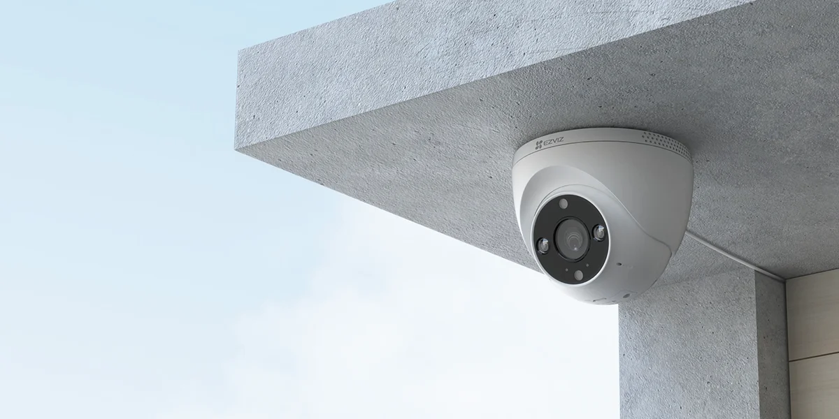 EZVIZ H4 2K dome camera mounted under an outdoor eave