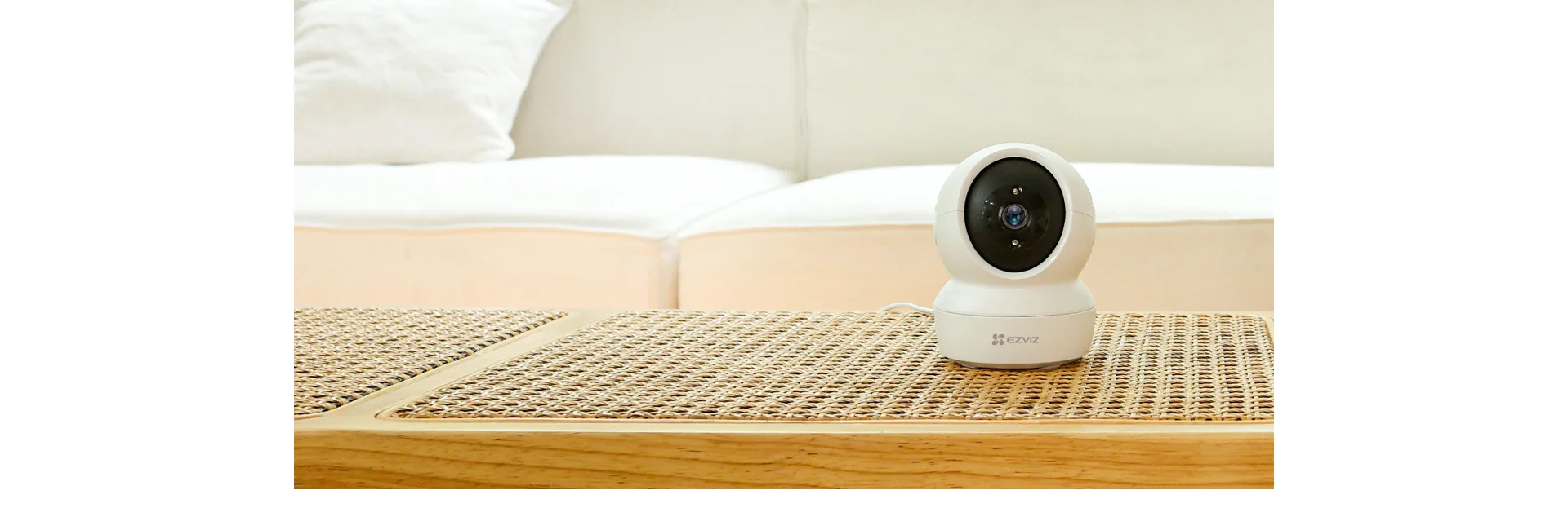 EZVIZ H6c 2MP camera on a table in a living room