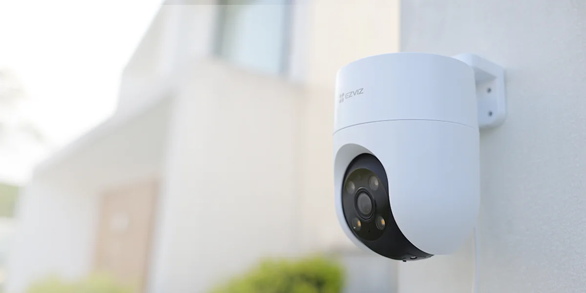 EZVIZ H8c 2K camera mounted on outdoor wall